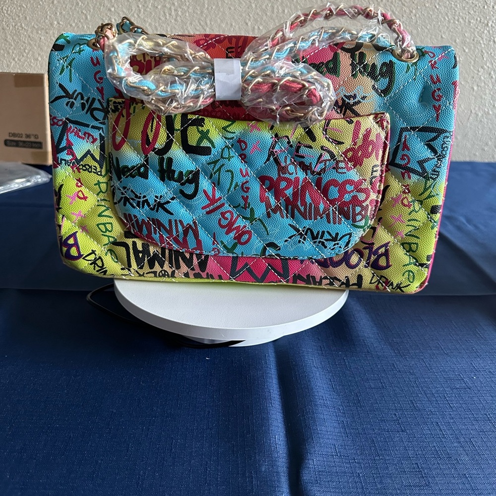 Vibrant Blue and Yellow Shoulder Bag with Artistic Flair